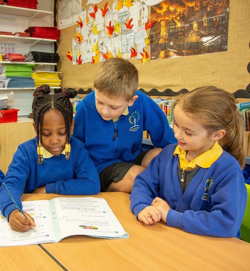 children at desk working